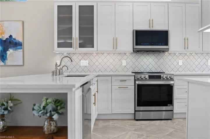 Every detail earns its place- from the geometric backsplash to the gold hardware that catches the light just right