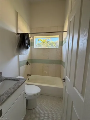 Bathroom with vanity and shower / bathtub combination