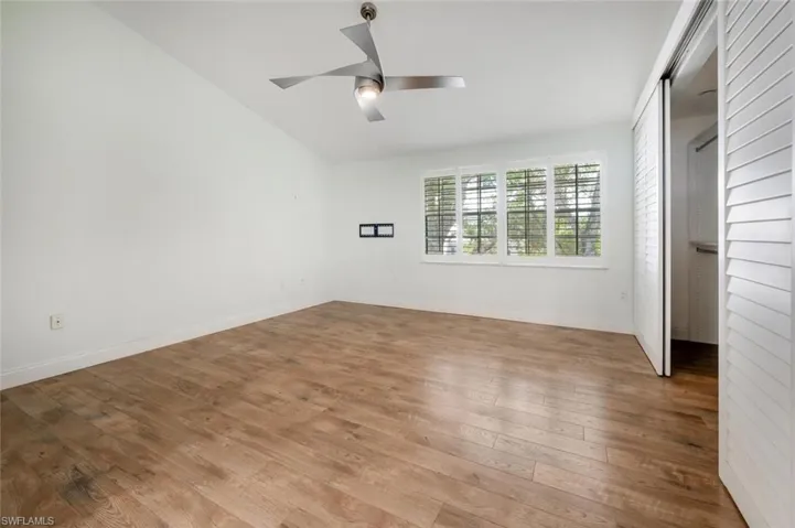 Unfurnished bedroom featuring ceiling fan and light hardwood / wood-style floors