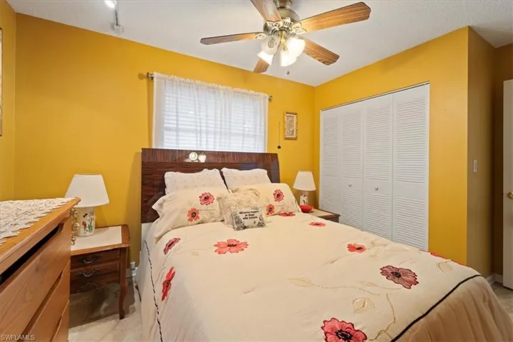 Bedroom with a closet and ceiling fan