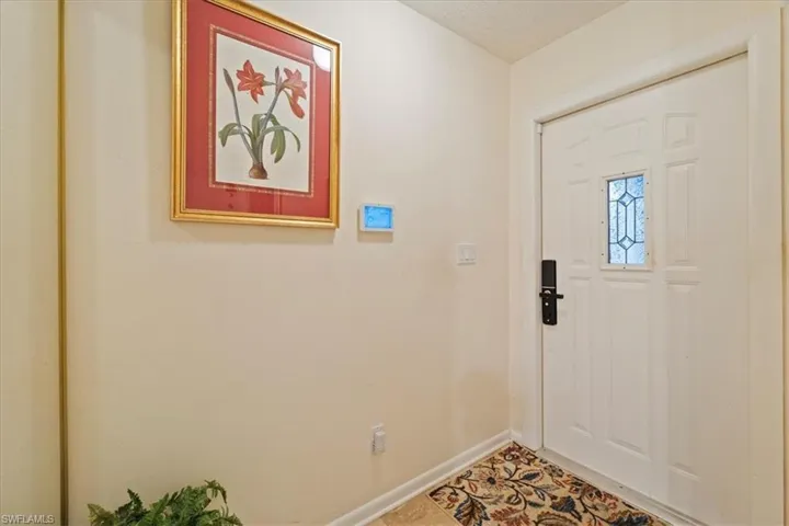 Foyer featuring tile patterned floors and a textured ceiling