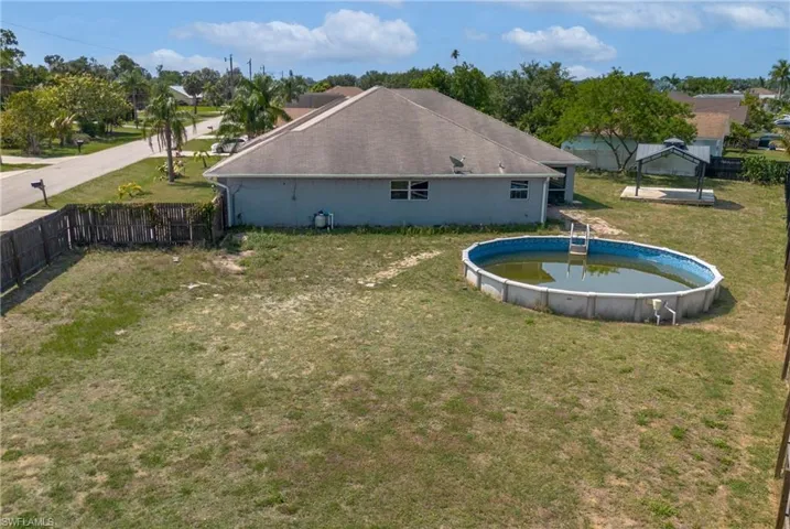 View of yard with a fenced in pool