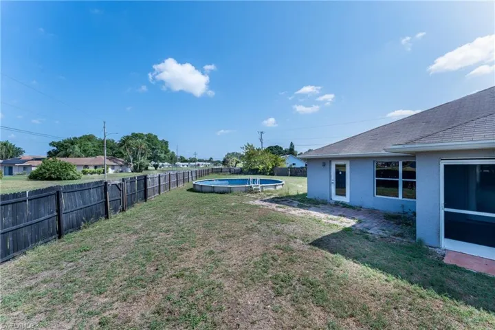 View of yard featuring a fenced in pool