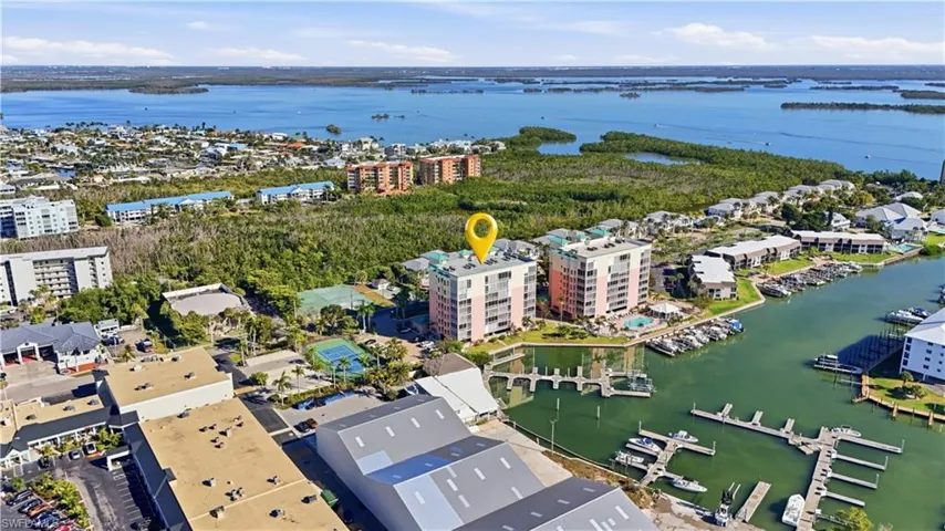 Santini Plaza in the foreground, Marina in front of building and easy boating access to the bay