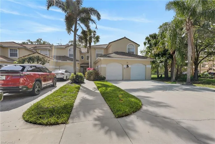 Mediterranean / spanish-style home featuring stucco siding, a tile roof, driveway, and a garage