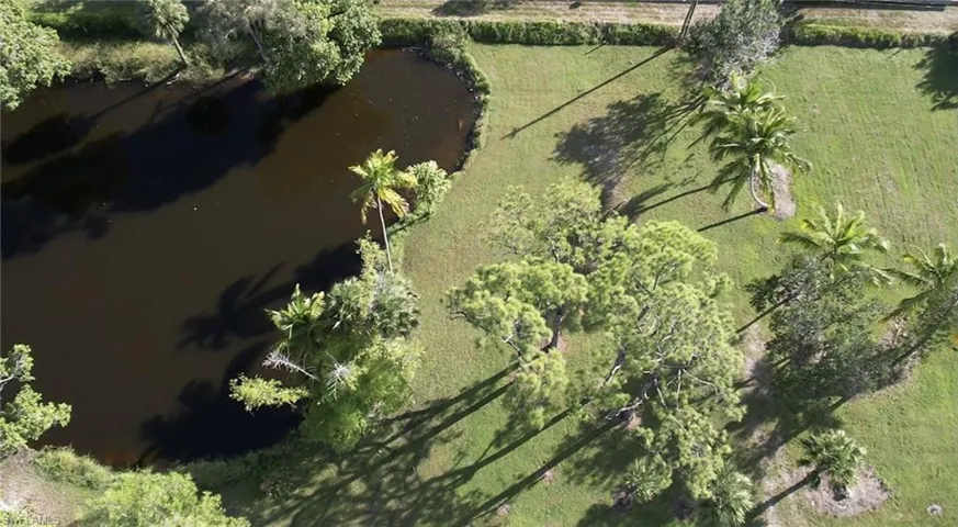 Aerial overview of property's location featuring a large body of water