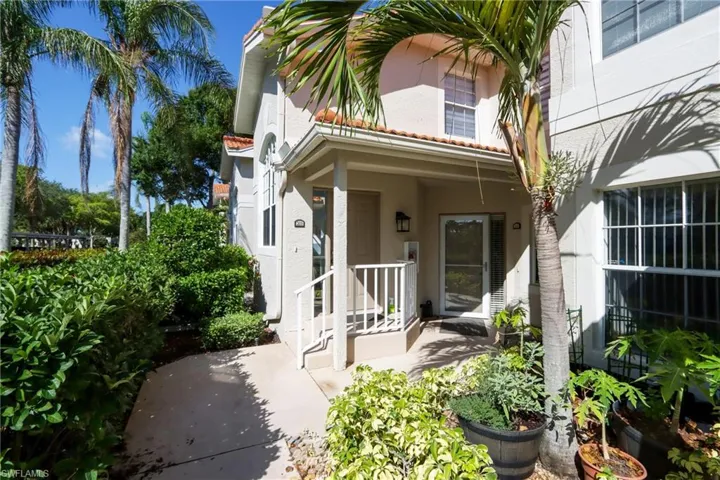 View of exterior entry with stucco siding