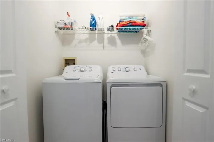 Laundry room featuring independent washer and dryer