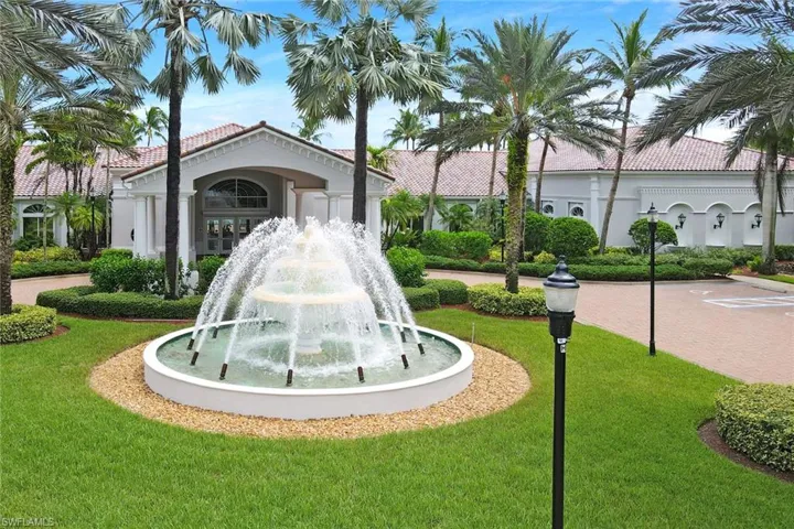 View of property's community featuring a yard