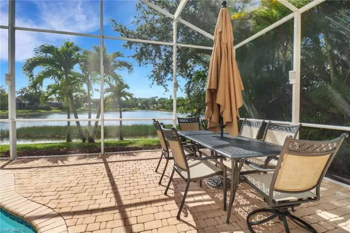 Unfurnished sunroom with a water view
