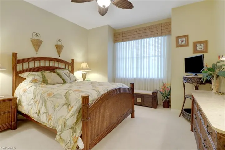 Bedroom featuring ceiling fan and light colored carpet