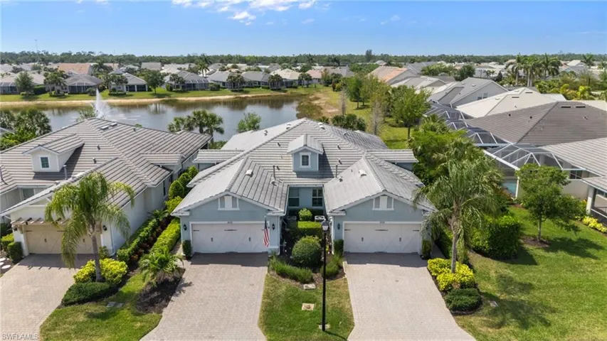 Aerial view featuring a residential view and a water view