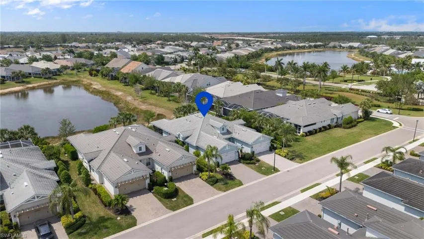 Aerial view featuring a residential view and a water view