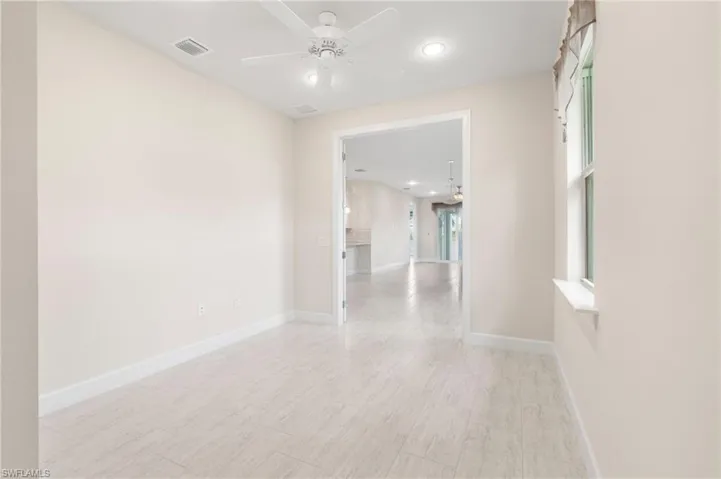 Empty room featuring recessed lighting, baseboards, ceiling fan, and visible vents