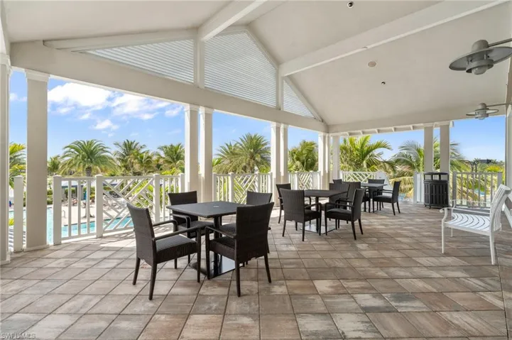 View of patio / terrace featuring an outdoor pool, fence, and outdoor dining space