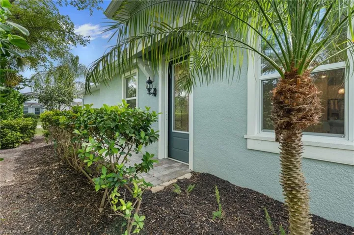 View of exterior entry featuring stucco siding