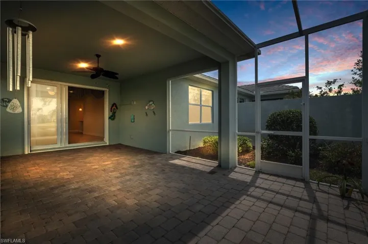 Unfurnished sunroom with a ceiling fan