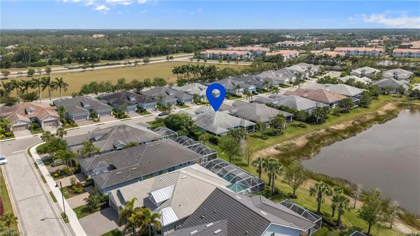 Birds eye view of property featuring a residential view and a water view