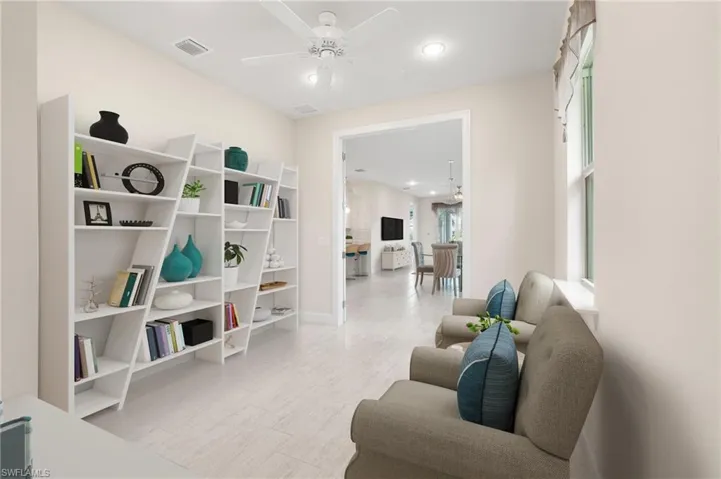 Sitting room featuring visible vents, recessed lighting, and a ceiling fan