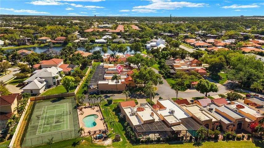Birds eye view of property featuring a residential view and a water view
