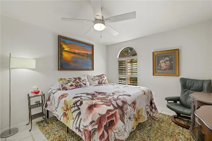 Bedroom with baseboards and ceiling fan