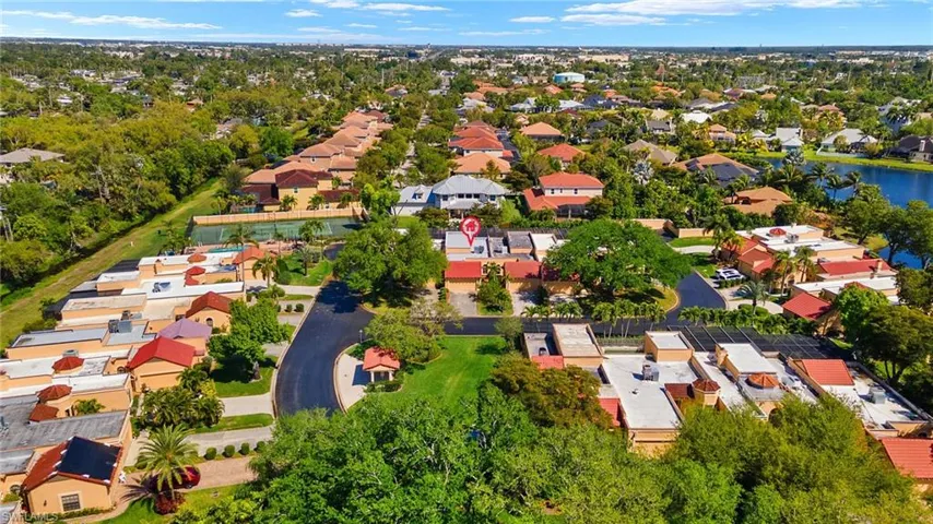 Drone / aerial view with a residential view and a water view