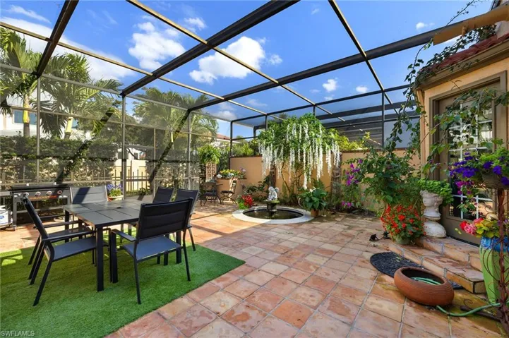 View of patio / terrace featuring a lanai