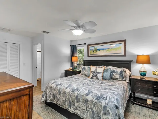 Bedroom featuring light wood-type flooring, a closet, and ceiling fan