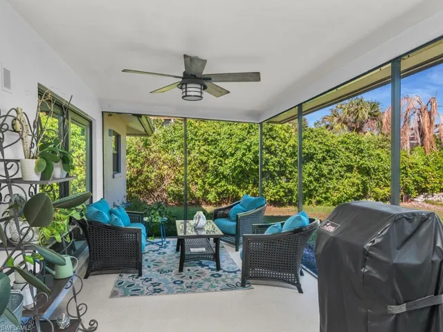Sunroom / solarium featuring ceiling fan