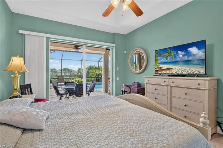 Master suite with view of pool and canal
