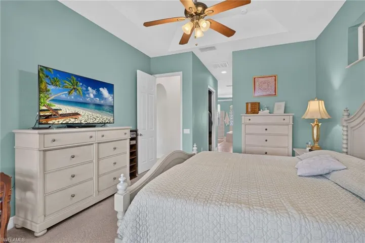 Master suite with opening to closets and luxurious bathroom features