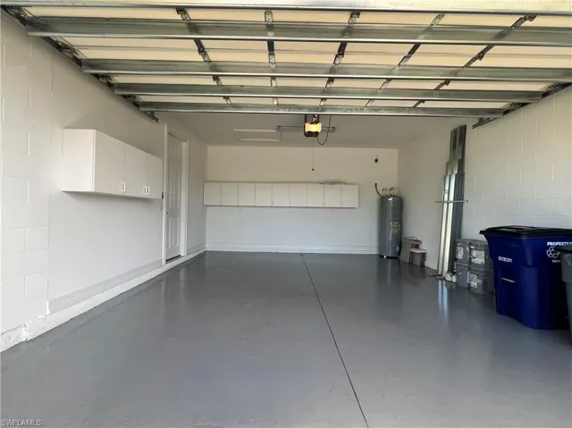 Two car garage with extra cabinets