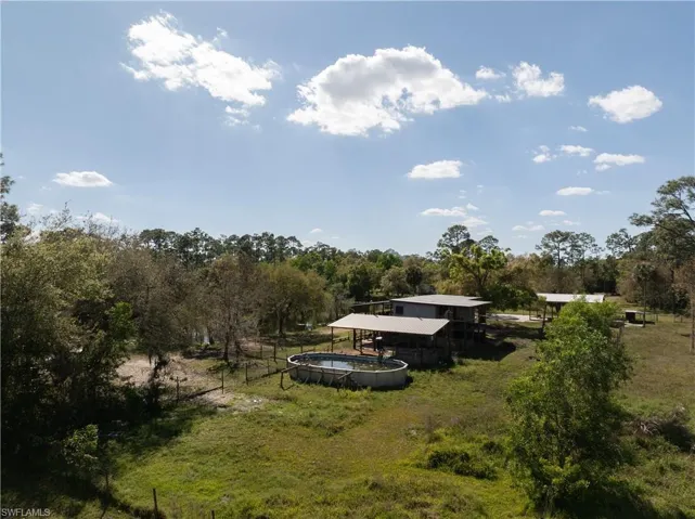 View of yard featuring a rural view and an outdoor pool