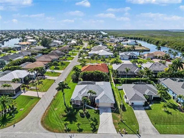 Aerial view of residential area featuring a nearby gulf access homes