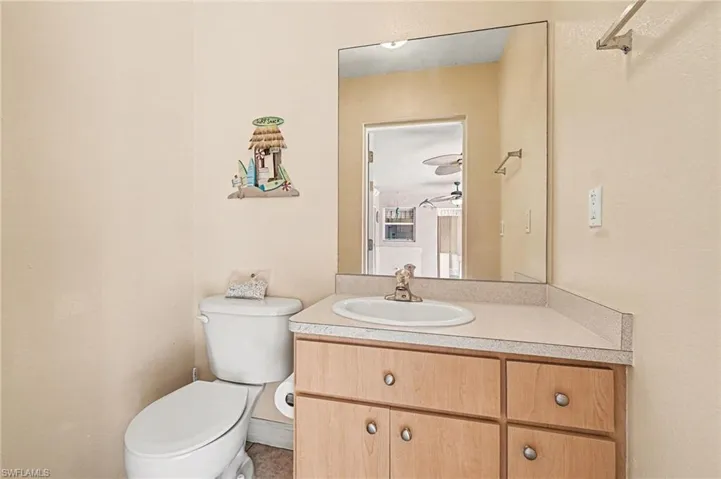 Half POOL bathroom with toilet and vanity