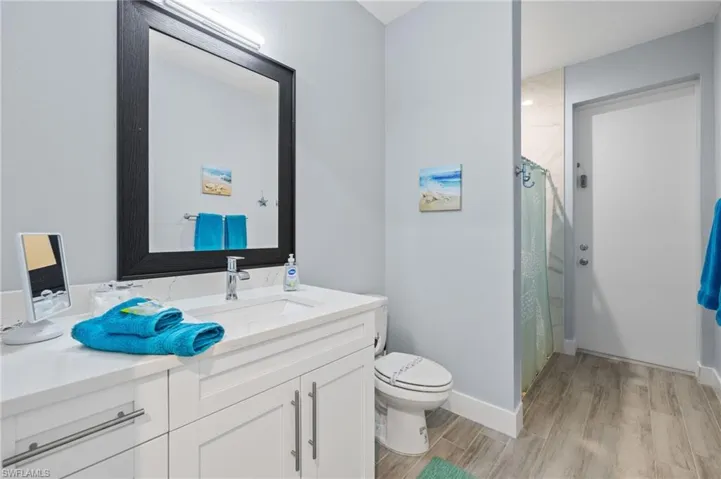 Main bath, shower only and easy access to pool.