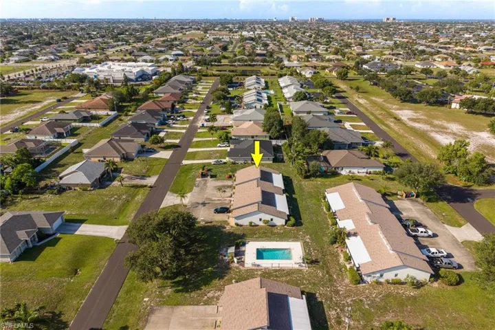 Aerial perspective of a residential neighborhood featuring multiple single-story structures