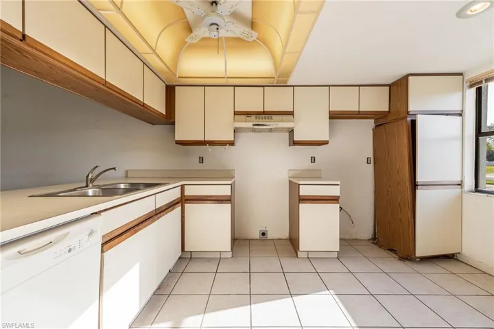 Kitchen featuring cabinetry & a double basin sink