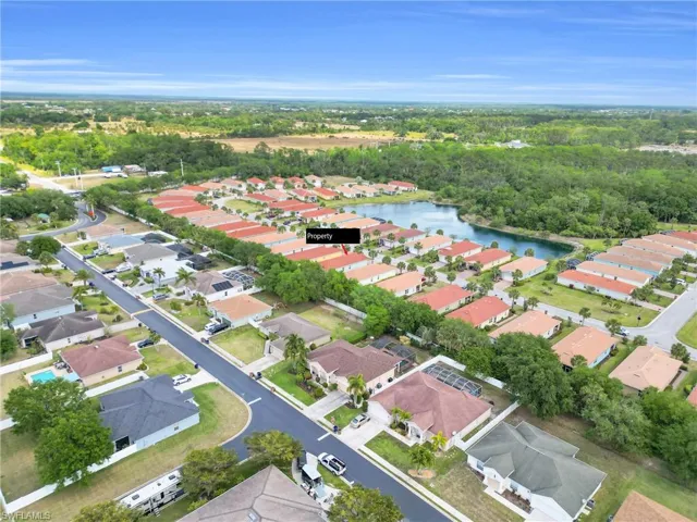 Aerial view with a water view and a residential view