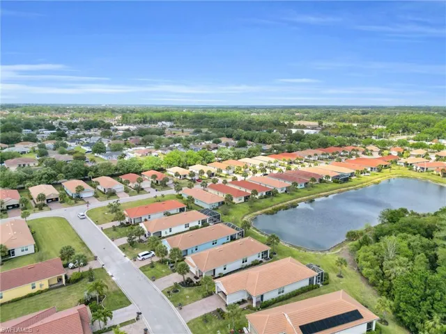 Drone / aerial view featuring a water view and a residential view