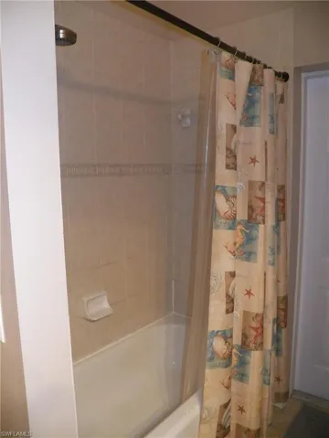 Bathroom featuring shower / tub combo