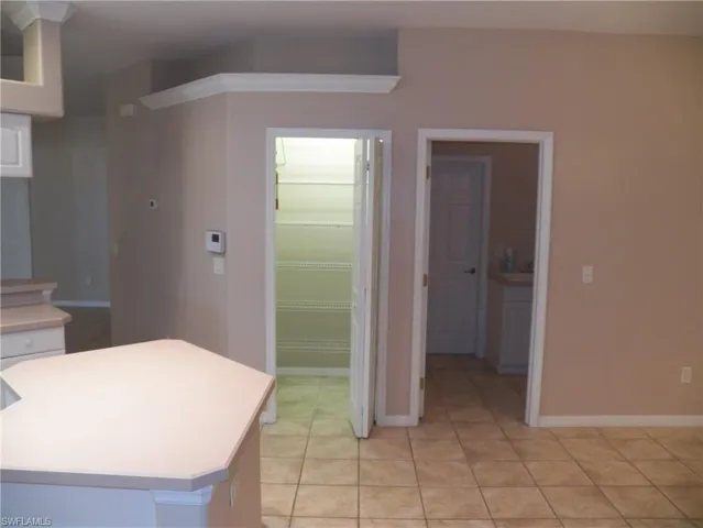 Kitchen with walk in pantry and door to the laundry room