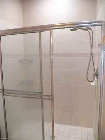 Bathroom with a shower with door