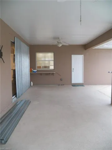 Lanai area under truss, pool bath door