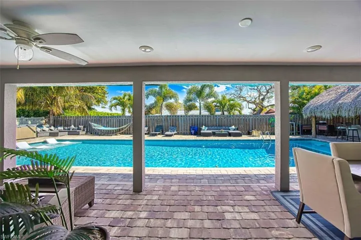 View of swimming pool featuring patio surround, outdoor lounge area, and a fenced backyard