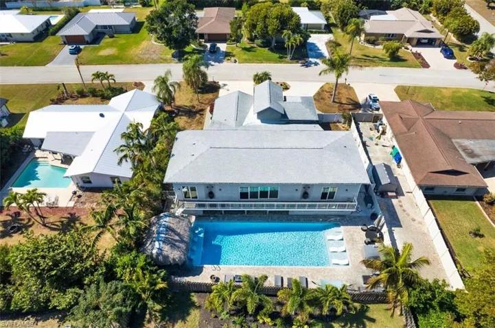 Aerial perspective of suburban area with a pool area