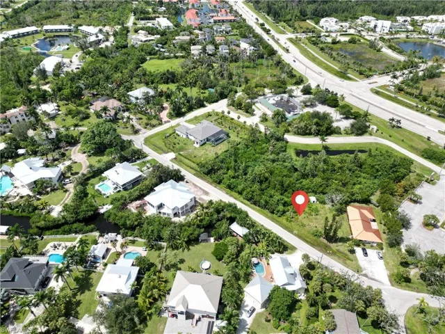 View of property location with a large body of water and nearby suburban area
