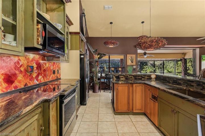 Custom Kitchen with Unique Glass Backsplash
