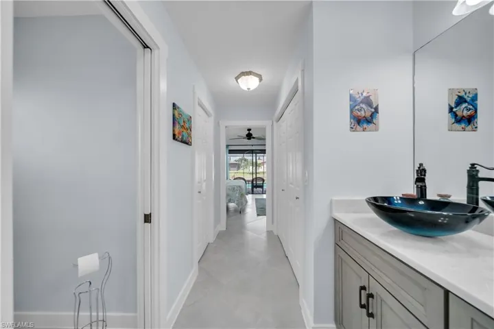 Bathroom featuring vanity and ceiling fan