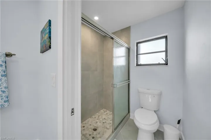Bathroom featuring a stall shower and tile patterned floors